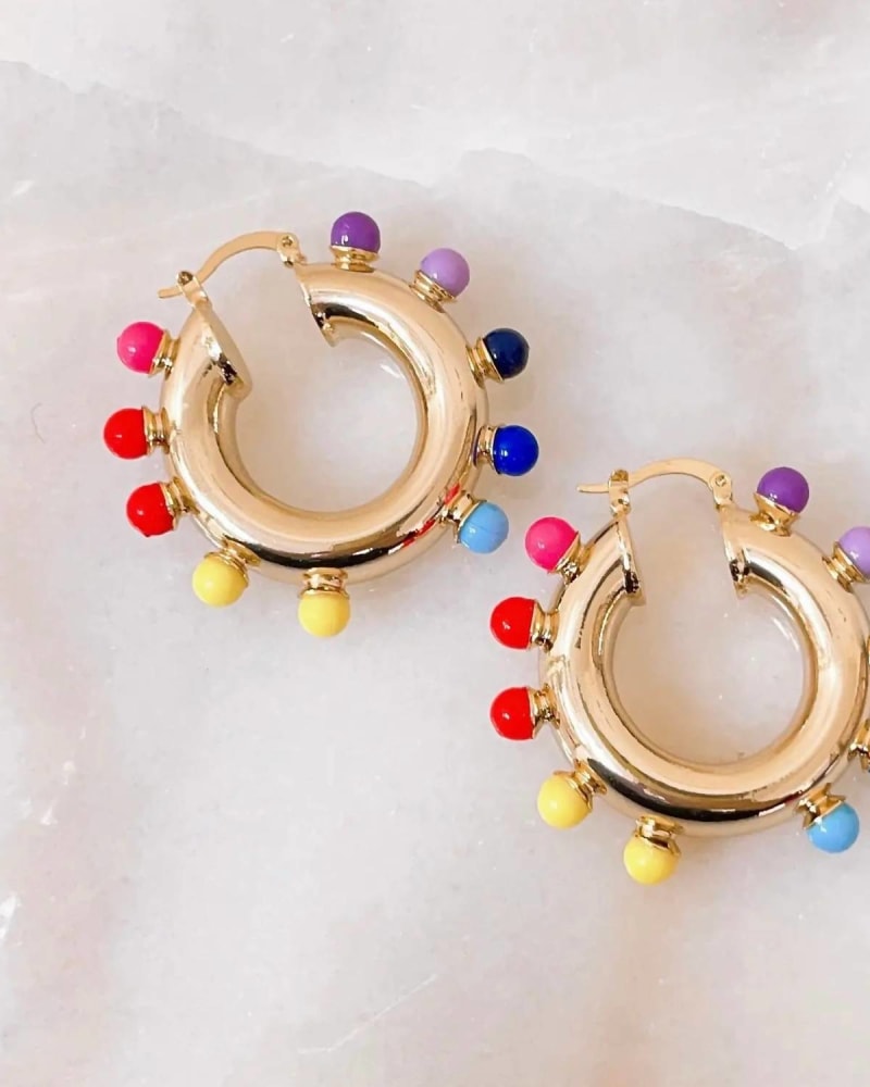 Front of a size O/S Melcochas Earrings in Multi in Multi by Treasure Jewels. | dia_product_style_image_id:329341